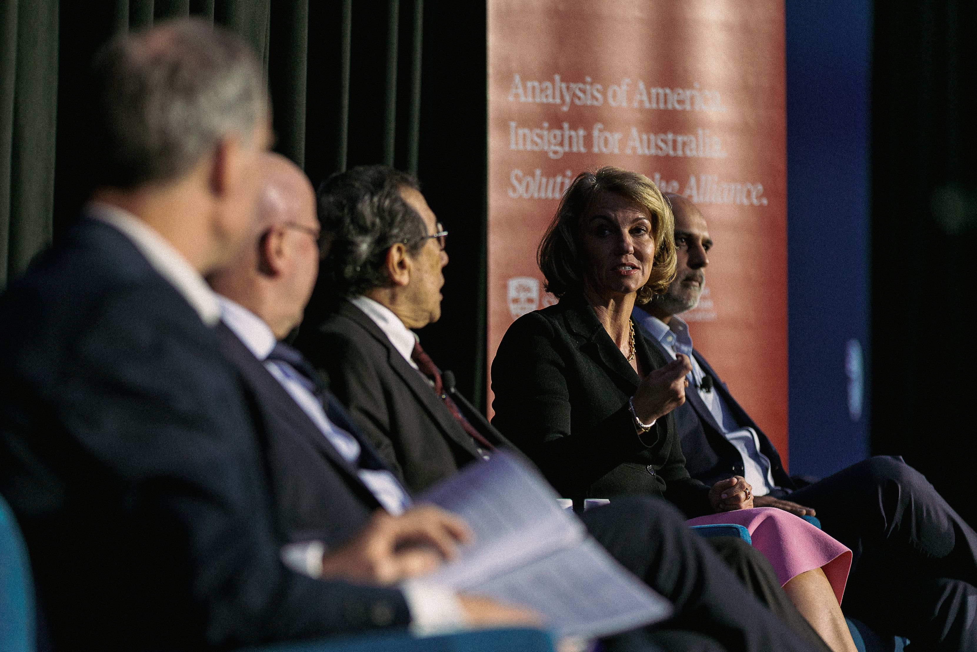 Jo Masters speaks on stage with fellow panellists.