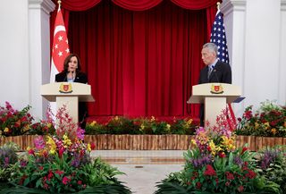 US Vice President Kamala Harris speaks beside Singapore’s Prime Minister Lee Hsien Loong during a joint news conference in Singapore, August 2021 (Getty)