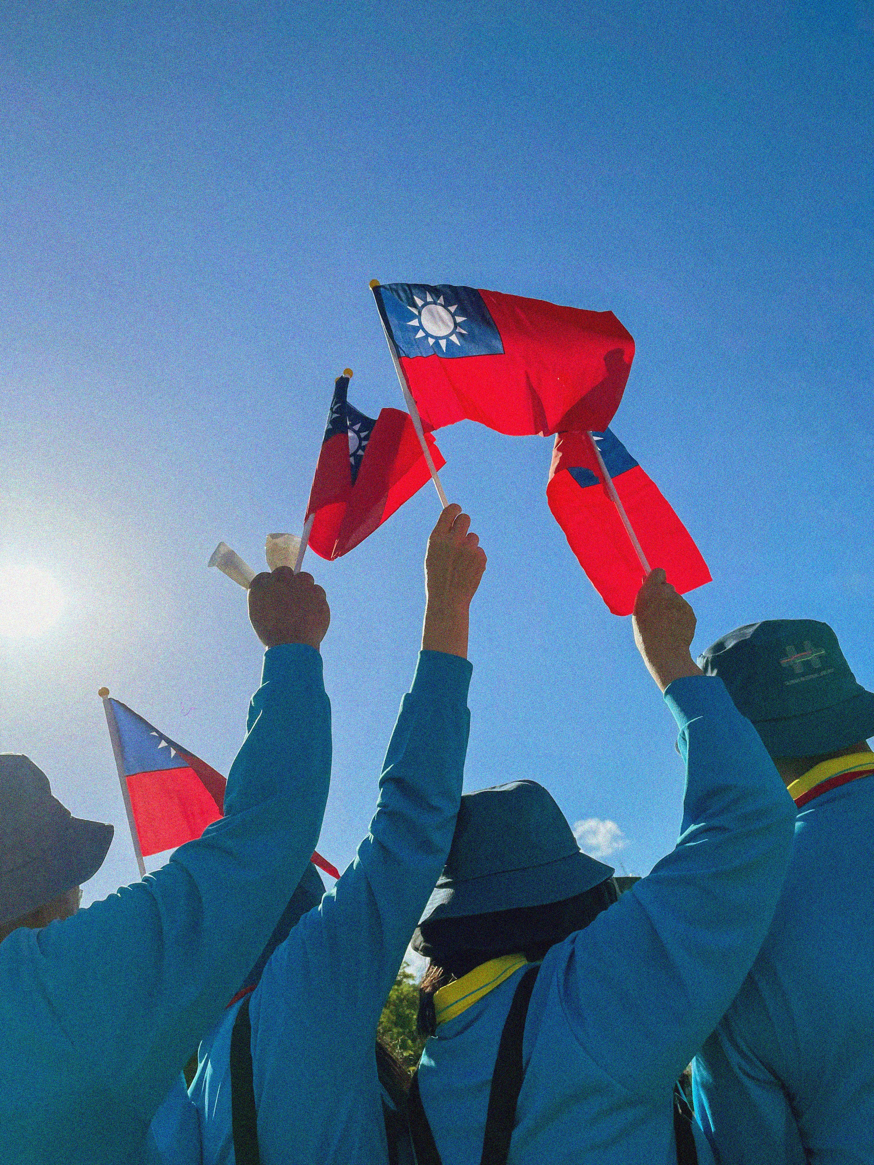 People waving Taiwanese flags
