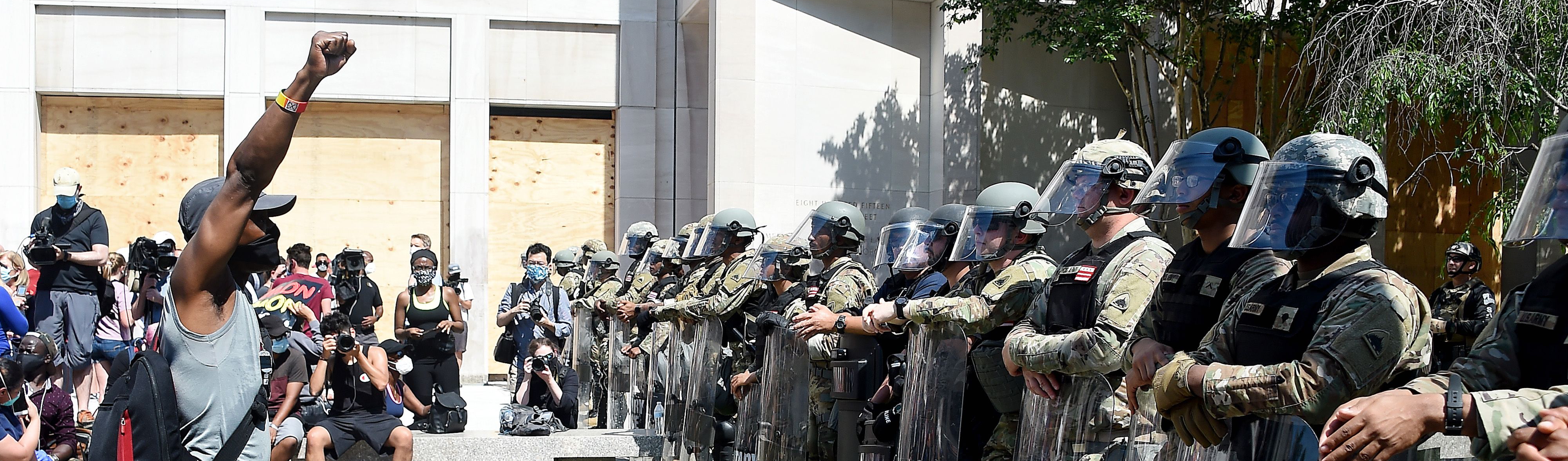 BLM-protestor-vs-armed-police-header-GettyImages-1217482114.png