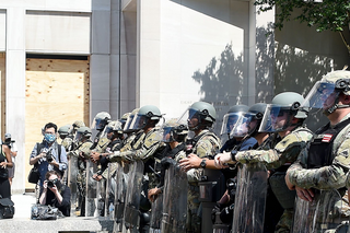 BLM-protestor-vs-armed-police-header-GettyImages-1217482114.png