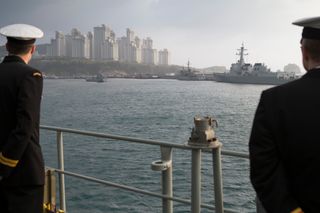 HMAS Arunta enters the port city of Busan, Republic of Korea, as part of the ship’s North East Asian deployment