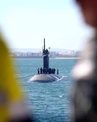 Submarine coming into port.