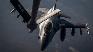 A U.S. Air Force F-16 Fighting Falcon aircraft approaches a KC-135 Stratotanker aircraft to refuel in the U.S. Central Command area of responsibility July 22, 2026.