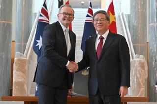Australia's Prime Minister Anthony Albanese shakes hands with Chinese Premier Li Qiang at Australian Parliament House, Canberra, June 2024