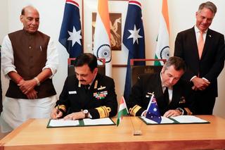 ndian Defence Minister, Shri Rajnath Singh (L) and Deputy Prime Minister and Minister for Defence, Richard Marles (R) witness Vice Chief of the Naval Staff of India, Sanjay Vatsayan (2nd-L) and Australia's Deputy Chief of Navy Matt Buckley (2nd-R) signing defence cooperation documents to Australia for his first official visit on October 09, 2025 in Canberra, Australia