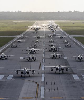 Aircraft from the Royal Australian Air Force, United States Air Force, United States Marine Corps, Japan Air Self-Defense Force, Republic of Korea Air Force and French Air and Space Force participate in an elephant walk to mark the beginning of Exercise Cope North 2024, Andersen Air Force Base, Guam