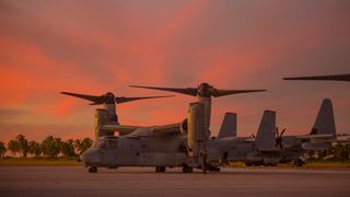 MV-22 Ospreys and KC-130J Hercules are parked during Marine Rotational Force — Darwin trans-Pacific flight, Cassidy International Airport, Kiribati, September 2019