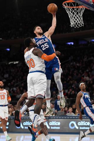 NBA player Ben Simmons, of the Philadelphia 76ers, slam dunks at New York’s Madison Square Garden in 2020