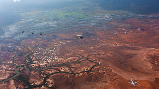Royal Australian Air Force, United States Pacific Air Force and Japanese Air Self Defence Force aircraft conduct a trilateral photo exercise during Exercise Southern Cross in the Northern Territory, Australia.