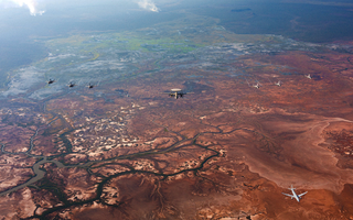 Royal Australian Air Force, United States Pacific Air Force and Japanese Air Self Defence Force aircraft conduct a trilateral photo exercise during Exercise Southern Cross in the Northern Territory, Australia.