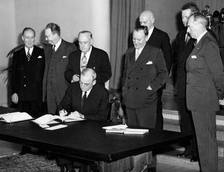 John Foster Dulles signs the Tripartite Security Treaty (ANZUS) in San Francisco with Secretary of State Dean Acheson (front, far right), 1 September 1951