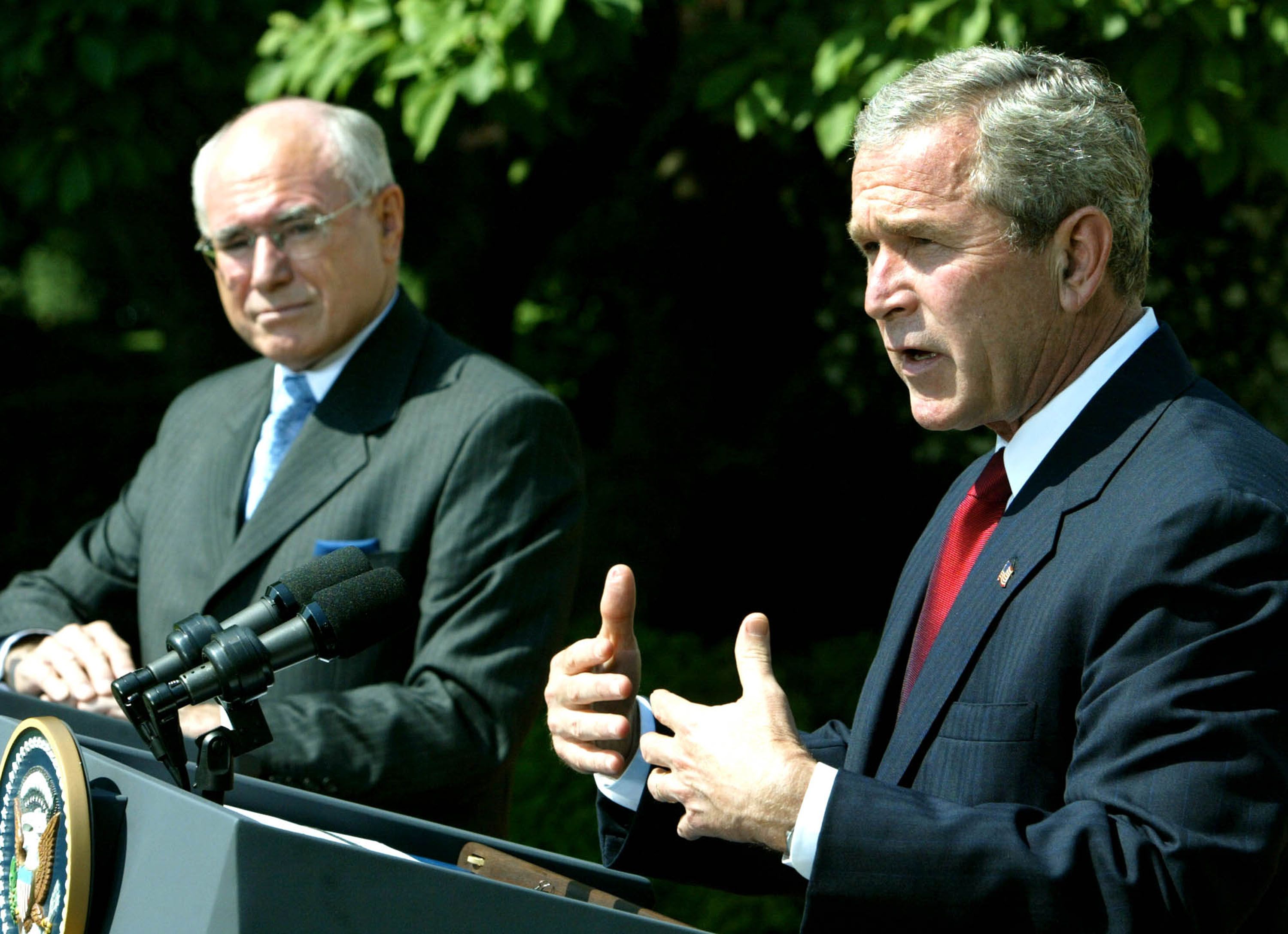 U.S. President George W. Bush (R) and Australian Prime Minister John Howard speak in the Rose Garden at the White House June 3, 2004 in Washington, DC. The two leaders met in the Oval Office and discussed Australian and U.S. relations as well as the war in Iraq.