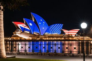 Sydney Opera House lit up with Australian and US flag design
