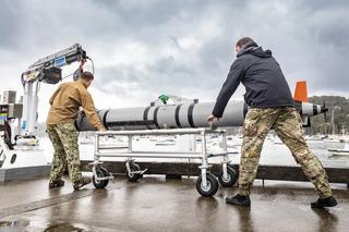Underwater Operators from the US Navy prepare to launch the Remus 600 autonomous underwater vehicle during Exercise AUKUS in New South Wales, October 2023.