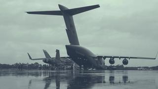 Members of the Royal Canadian Air Force (RCAF) and the Royal Australian Air Force (RAAF) load a F/A-18 aircraft on to an RCAF CC-177 Globemaster for transport back to Canada, as part of the Interim Fighter Capability Project at RAAF Base Williamtown, Australia, February 2020.