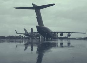 Members of the Royal Canadian Air Force (RCAF) and the Royal Australian Air Force (RAAF) load a F/A-18 aircraft on to an RCAF CC-177 Globemaster for transport back to Canada, as part of the Interim Fighter Capability Project at RAAF Base Williamtown, Australia, February 2020.
