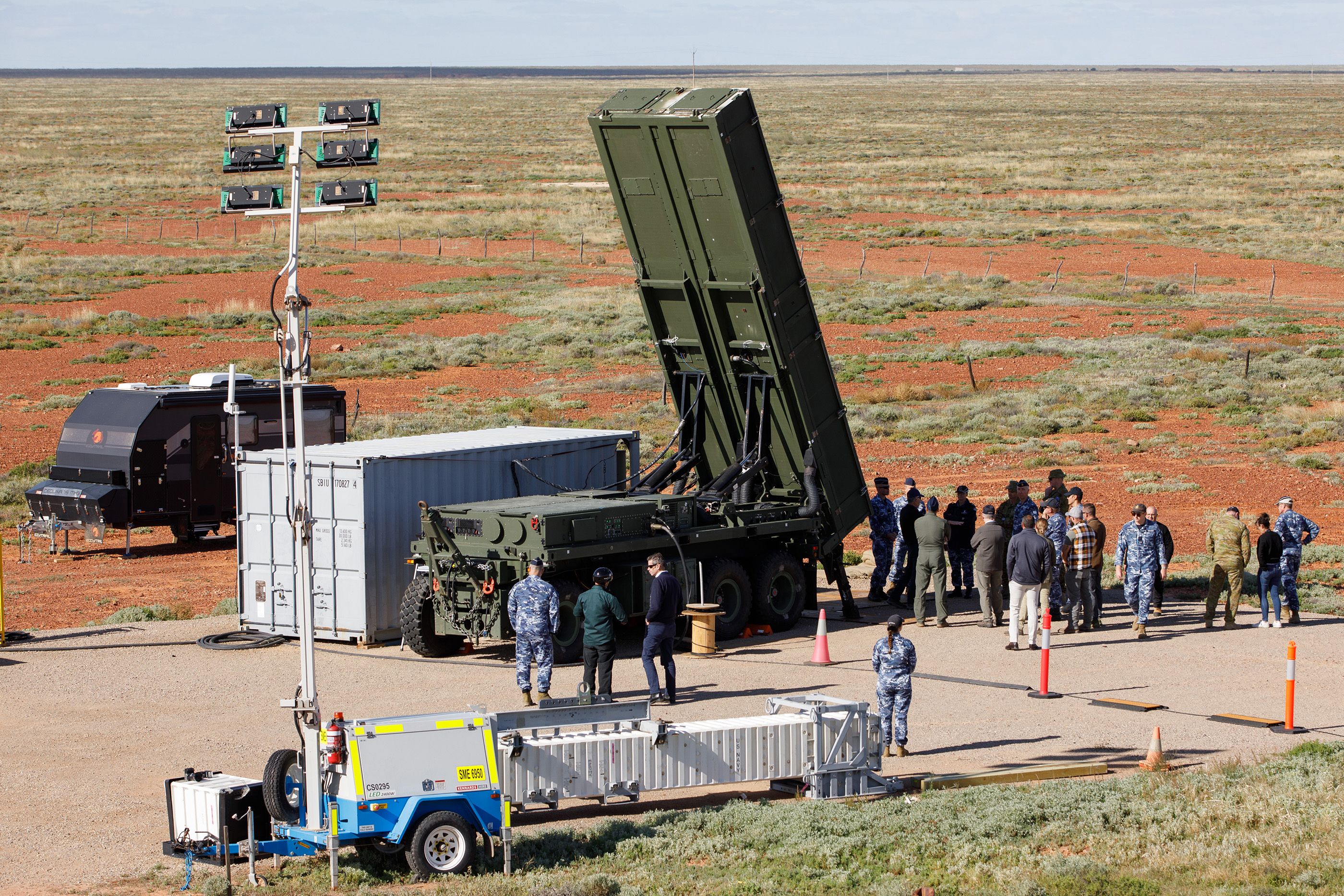 The long range Derringer trailer-mounted Expeditionary Launch System is visited by a group of VIPs during Exercise Taipan Strike 2026 activities held at the Woomera Test Range in South Australia.
