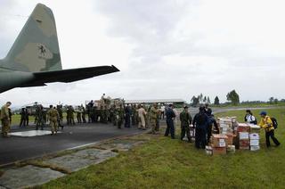 US Navy and members of the Australian and Indonesian militaries unload aid and supplies to refugees across Sumatra, Indonesia after the 2004 Indian Ocean tsunami and earthquake.