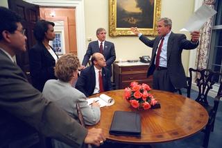 President George W Bush discusses with senior staff a speech he’ll deliver to the nation from the Oval Office, 11 September 2001