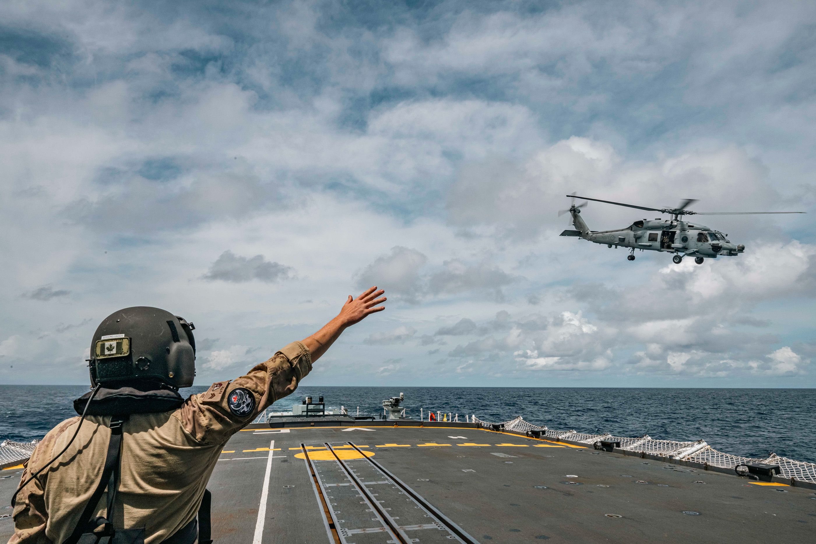 A Royal Australian Navy MH-60R Sea Hawk departs from the Royal Canadian Navy ship HMCS Ville de Québec during Exercise Alon 2025. 
