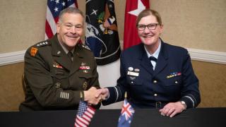 US Army General James Dickinson, US Space Command commander, and Royal Australian Air Force Air Vice-Marshal Catherine Roberts, commander of the Australian Defence Space Command, sign an enhanced space cooperation memorandum of understanding