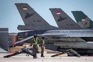 Ground crew prepare for the departure of Republic of Singapore Air Force F-16D Fighting Falcon jets for a mission from RAAF Base Darwin as part of Exercise Pitch Black 2022