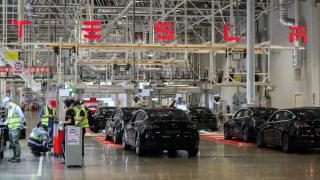 Employees work at the Tesla Gigafactory in Shanghai