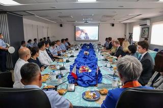 Foreign Minister Penny Wong receiving a briefing from the Philippine Coast Guard during a visit to Manila in May 2023