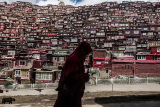 A man walking in Larung Gar