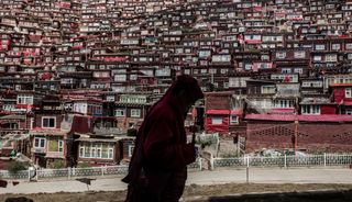 A man walking in Larung Gar