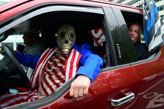 Protestors circle Philadelphia City Hall in vehicles to demand the reopening of Pennsylvania, 8 May 2020