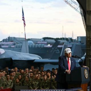 US President Donald Trump delivers a speech in front of US Navy personnel on board the US Navy's USS George Washington aircraft carrier at the US naval base in Yokosuka on October 28, 2025