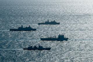 Four navy ships sail in formation during a military exercise
