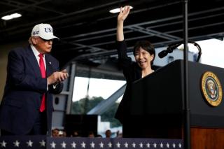 U.S. President Donald Trump applauds as Japanese Prime Minister Sanae Takaichi speaks to troops aboard USS George Washington at Fleet Activities Yokosuka on October 28, 2025 in Yokosuka, Japan. Trump is visiting Japan, fresh off an appearance at the ASEAN summit in Malaysia, and will next travel to South Korea for the APEC meetings.
