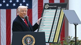 US President Donald Trump holds a chart as he delivers remarks on reciprocal tariffs during an event in the Rose Garden entitled "Make America Wealthy Again" at the White House in Washington, DC, on April 2, 2025.