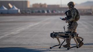 US Air Force Technical Sergeant John Rodiguez patrols with a Ghost Robotics Vision 60 prototype during the Advanced Battle Management System exercise, Nevada, September 2020
