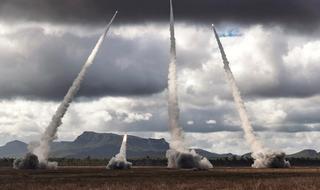 US Marine Corps and US Army High Mobility Artillery Rocket Systems perform a live firing drill at Plains Airfield, northern Australia, during Exercise Talisman Sabre 2019