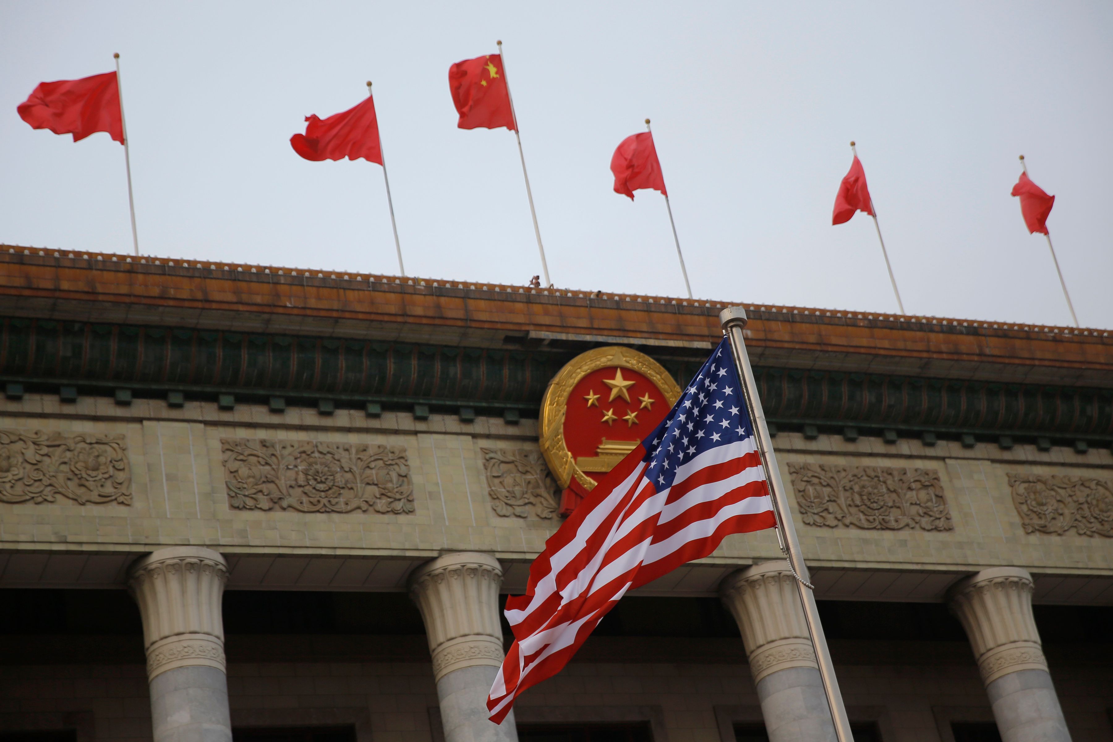 The U.S. flag and Chinese flags fly at a welcoming ceremony between Chinese President Xi Jinping and U.S. President Donald Trump November 9, 2017 in Beijing, China.