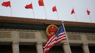 The U.S. flag and Chinese flags fly at a welcoming ceremony between Chinese President Xi Jinping and U.S. President Donald Trump November 9, 2017 in Beijing, China.