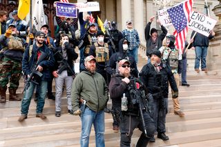 Armed protesters at the “Michiganders Against Excessive Quarantine” rally in Lansing, Michigan, 15 April 2020