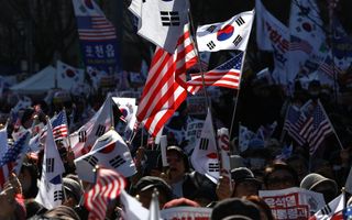 JANUARY 25: Supporters of impeached South Korean President Yoon Suk Yeol participate in a rally on January 25, 2025 in Seoul, South Korea. Yoon has been formally arrested on charges of leading an insurrection and abusing his power when he declared martial law on December 3.
