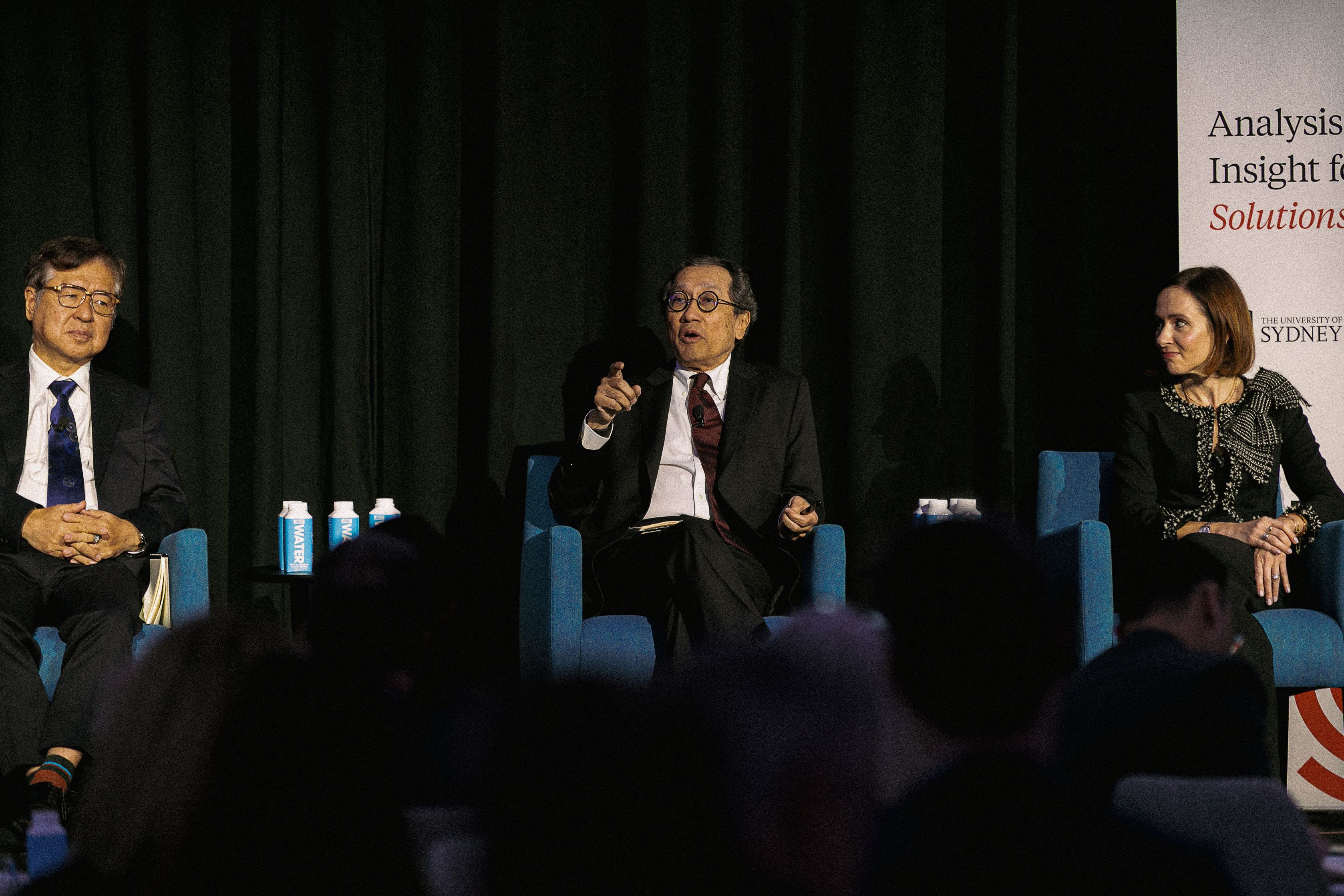 Bilahari Kausikan speaks on stage with fellow panellists.