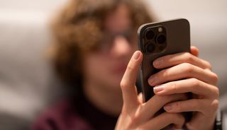 Teenager using a mobile phone