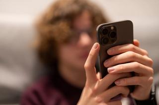 Teenager using a mobile phone