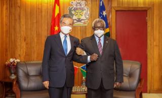 Solomon Islands Prime Minister Manasseh Sogavare meets with Chinese State Councilor and Foreign Minister Wang Yi in Honiara, May 2022