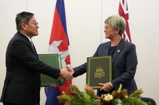 Cambodia Foreign Minister Sok Chenda Sophea shakes hands with Australian Foreign Affairs Minister Penny Wong