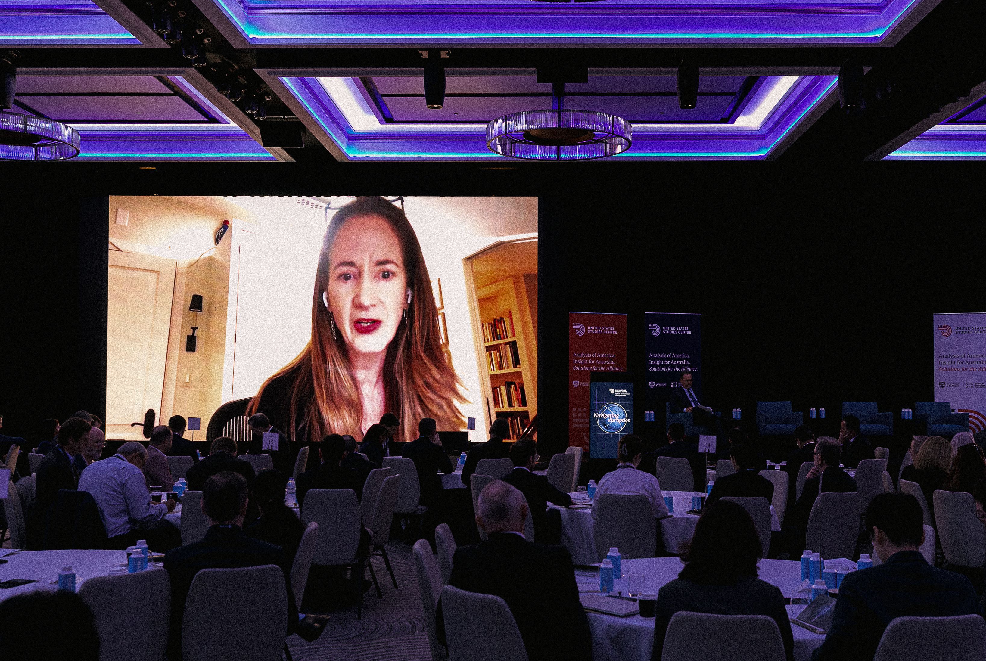 Avril Haines speaking on screen at the conference.