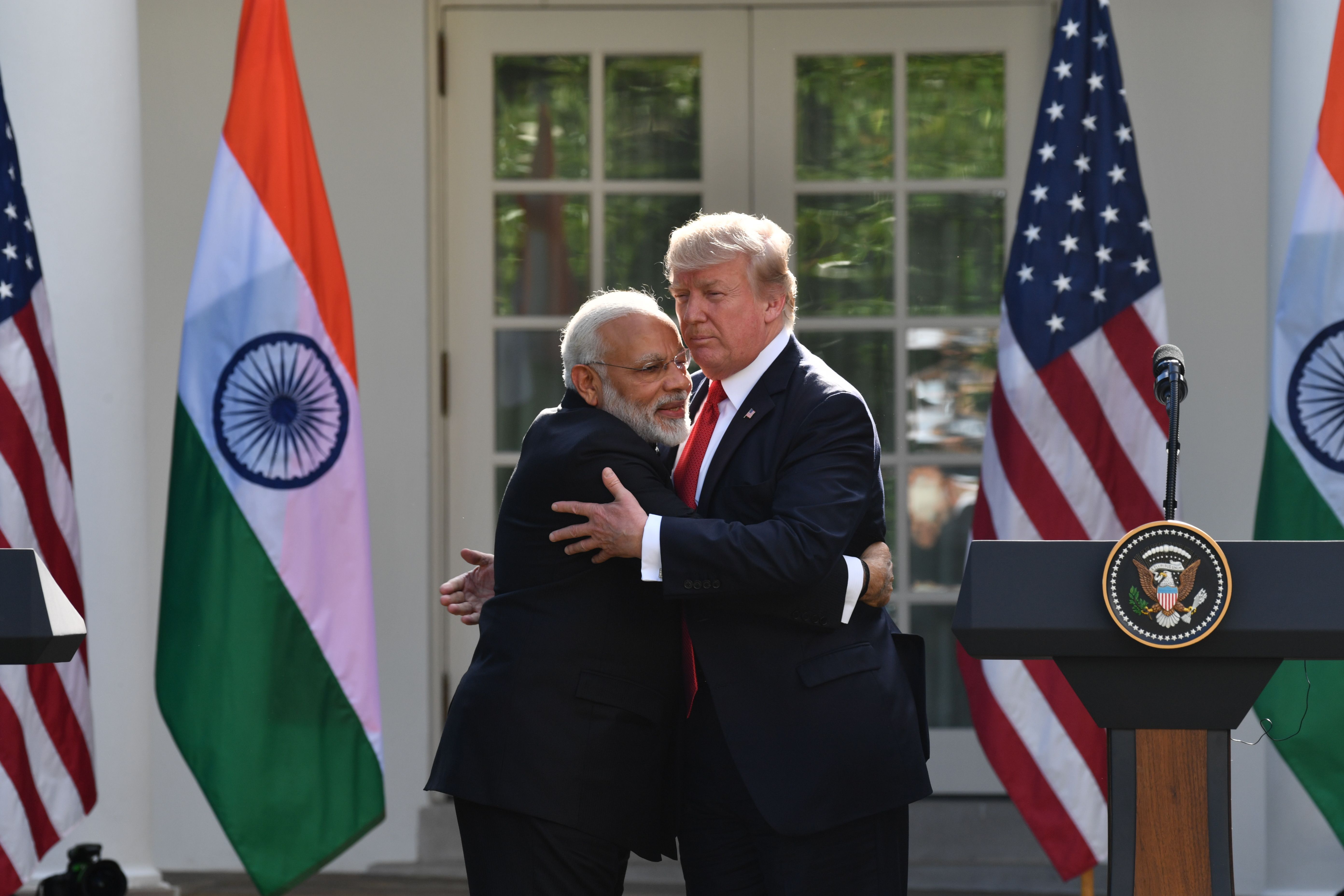 US President Donald Trump and Indian Prime Minister Narendra Modi embrace in the Rose Garden during a joint press conference  at the White House in Washington, DC, June 26, 2017.