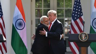 US President Donald Trump and Indian Prime Minister Narendra Modi embrace in the Rose Garden during a joint press conference at the White House in Washington, DC, June 26, 2017.